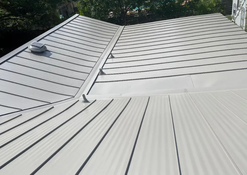 Solar attic fan installed on a metal roof for Roof Ventilation in LaBelle